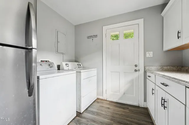 a kitchen with granite countertop cabinets stainless steel appliances a sink and a window