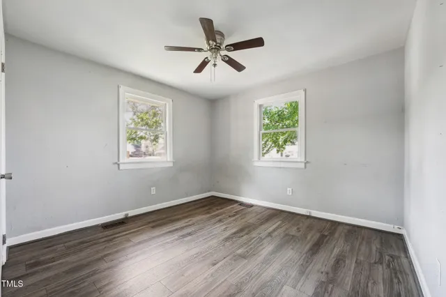 a utility room with cabinets washer and dryer