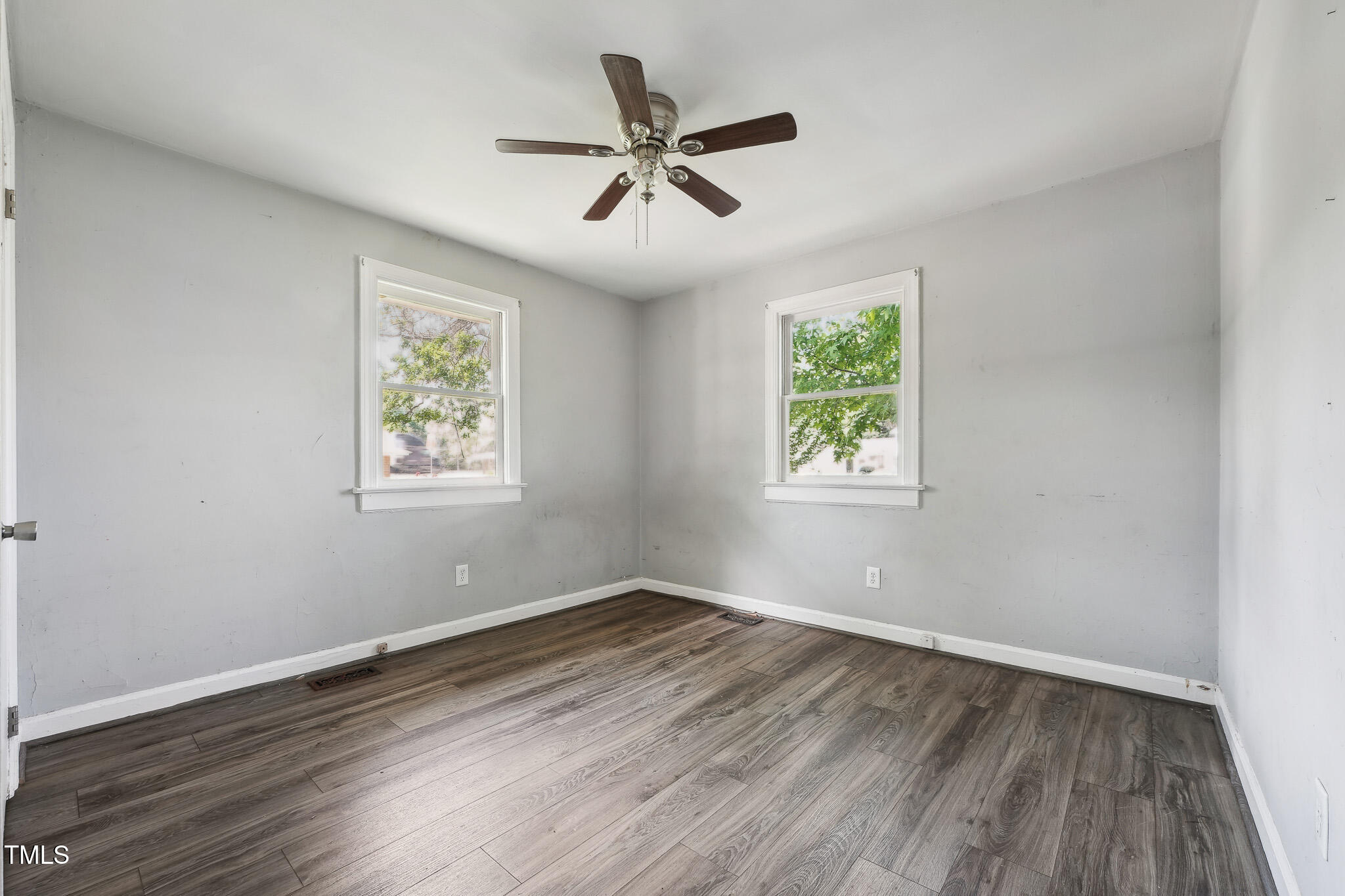 6316 Ward Boulevard Wilson, NC 27893 - Photo 9 of 36 wooden floor in an empty room with a window