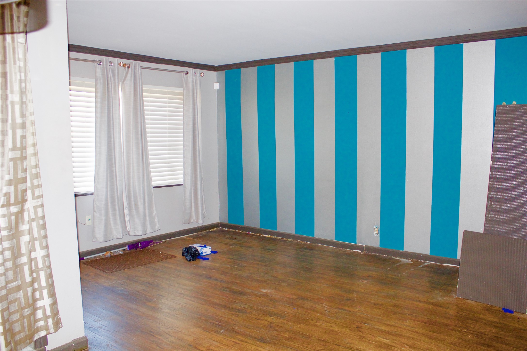 5218 Penfield Lane Houston, TX 77021 - Photo 4 of 11 a view of a room with wooden floor and a window