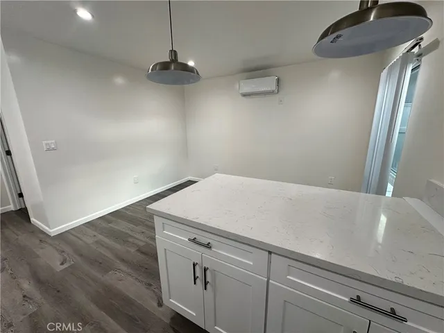 a view of a storage and utility room with closet