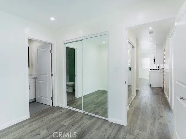 wooden floor with white walls