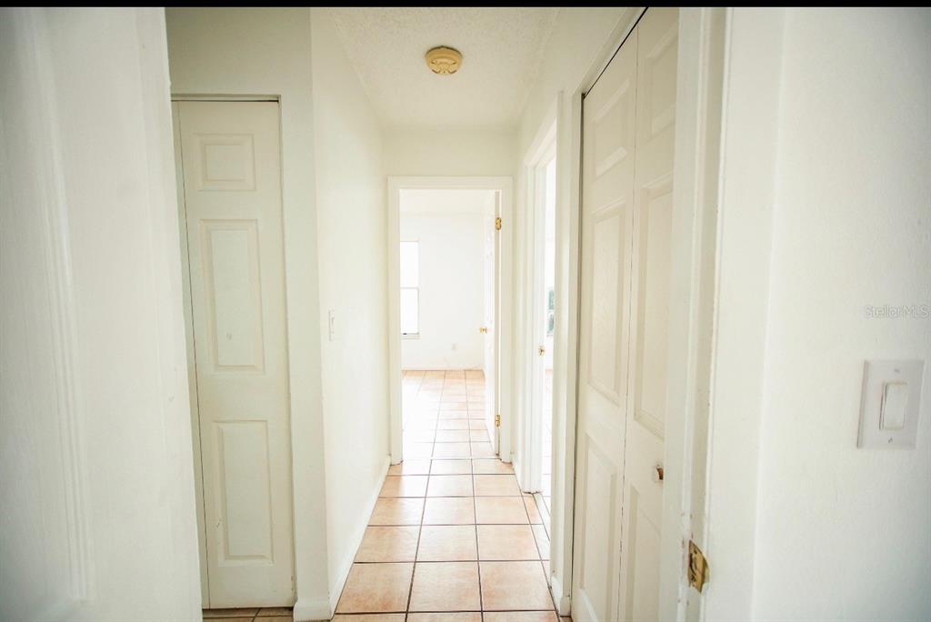 606 Water Road Ocala, FL 34472 - Photo 20 of 34 a bathroom with a glass shower door