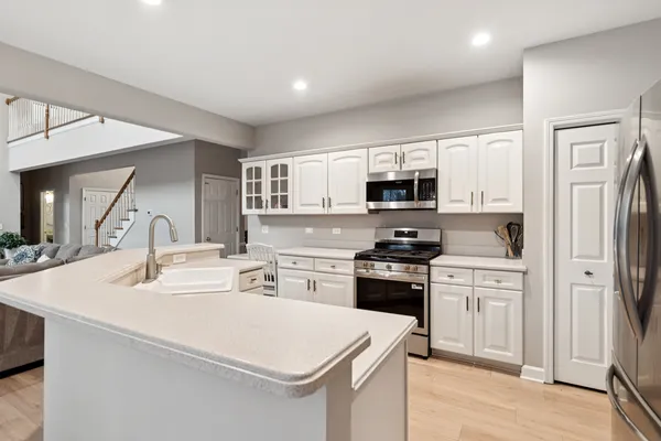 a kitchen with a sink a stove and refrigerator