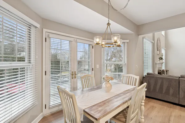 a view of a dining room with furniture window and outside view