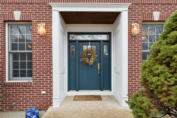 a front view of a house with a garden