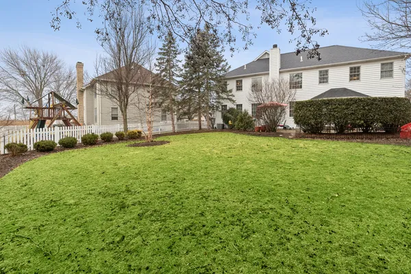 a view of a yard in front of a house