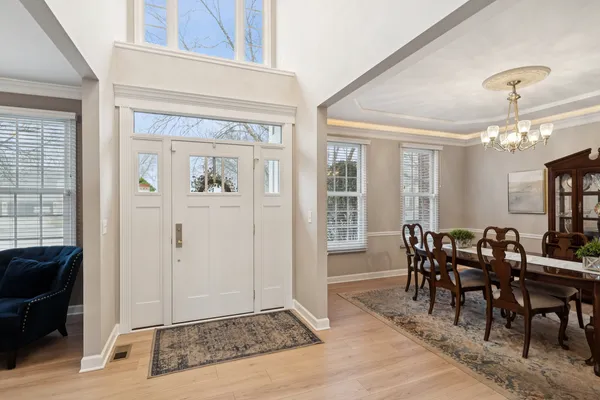 a view of a dining room with furniture and window