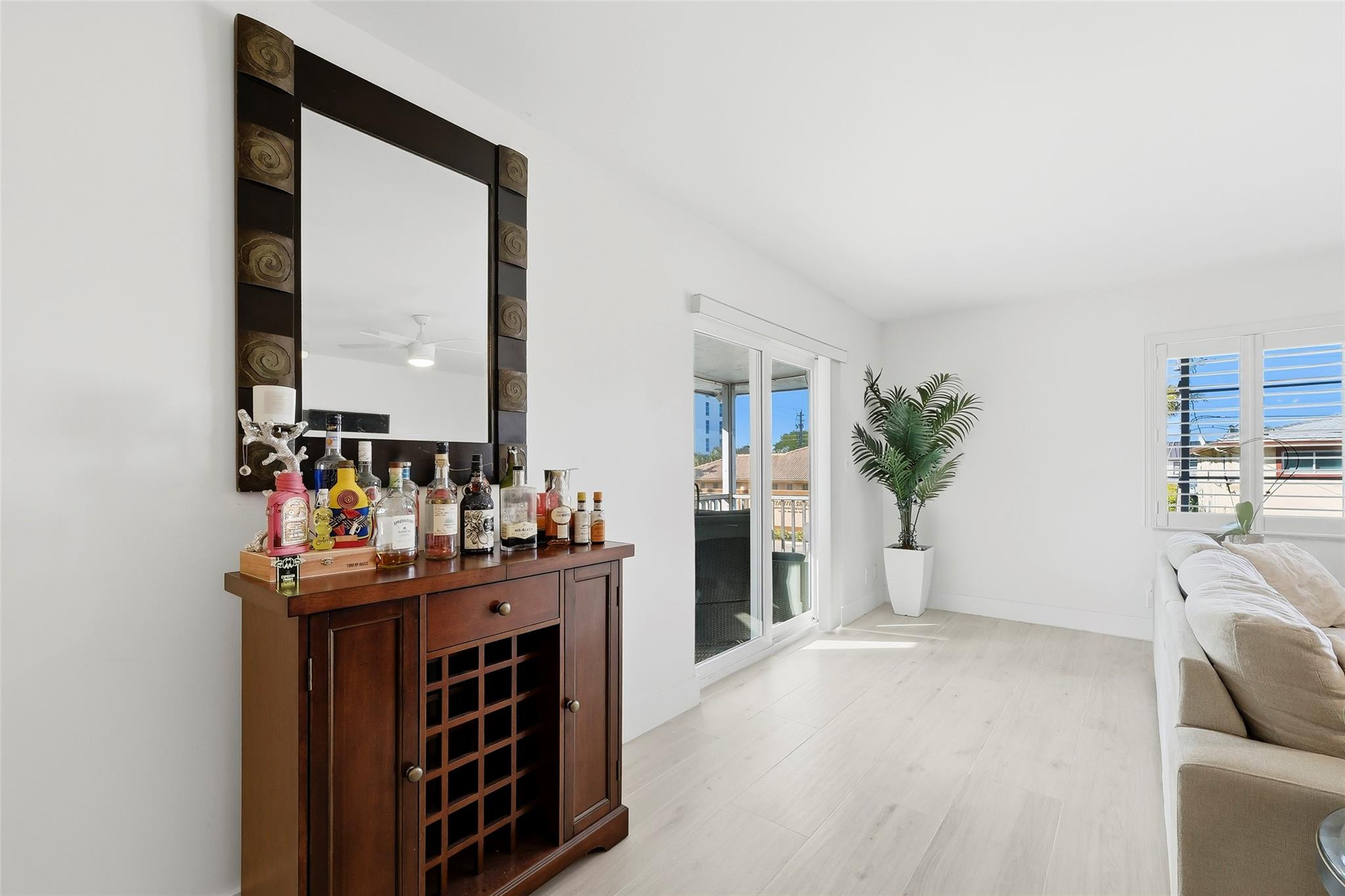 1450 North Riverside Drive, Unit 201 Pompano Beach, FL 33062 - Photo 21 of 30 a living room with furniture and a fireplace