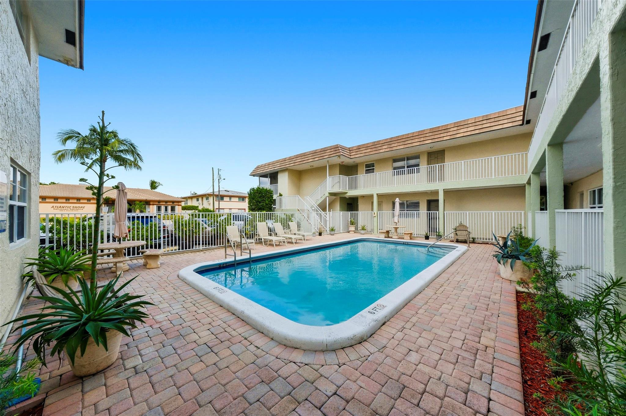1450 North Riverside Drive, Unit 201 Pompano Beach, FL 33062 - Photo 29 of 30 a view of a house with pool and sitting area