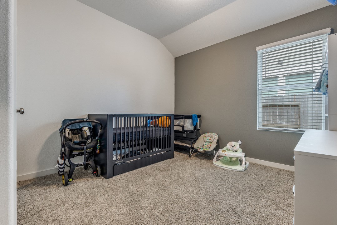 1318 Cascade Hls Drive Rosharon, TX 77583 - Photo 20 of 25 a bedroom with furniture and a window