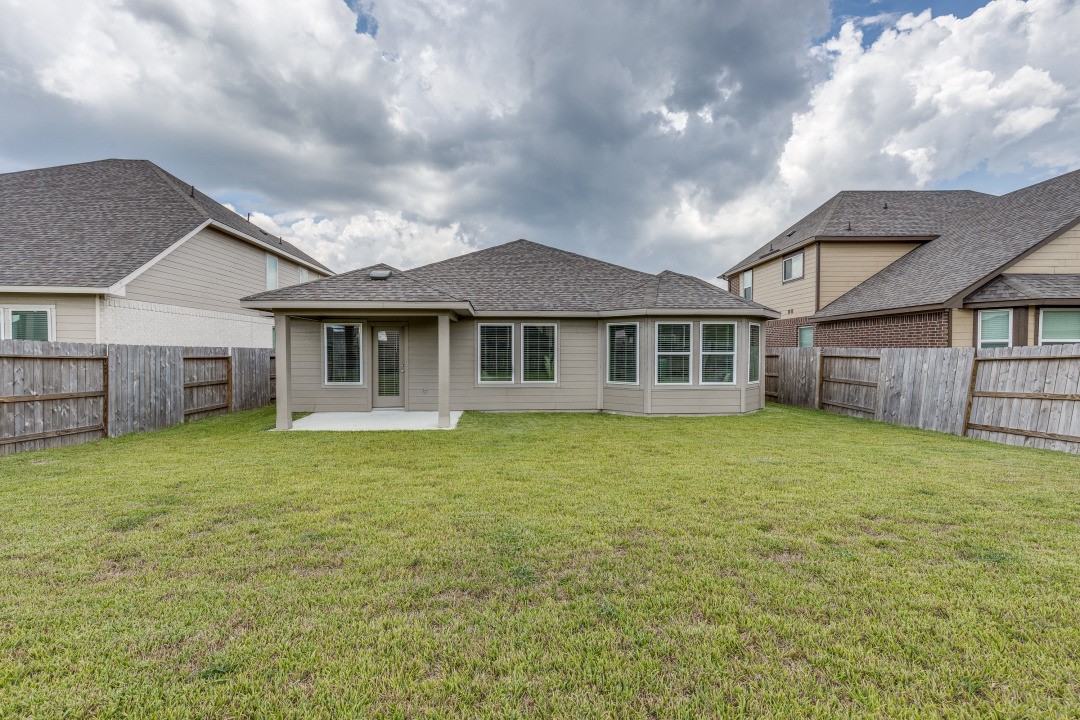 1318 Cascade Hls Drive Rosharon, TX 77583 - Photo 24 of 25 a front view of a house with a garden