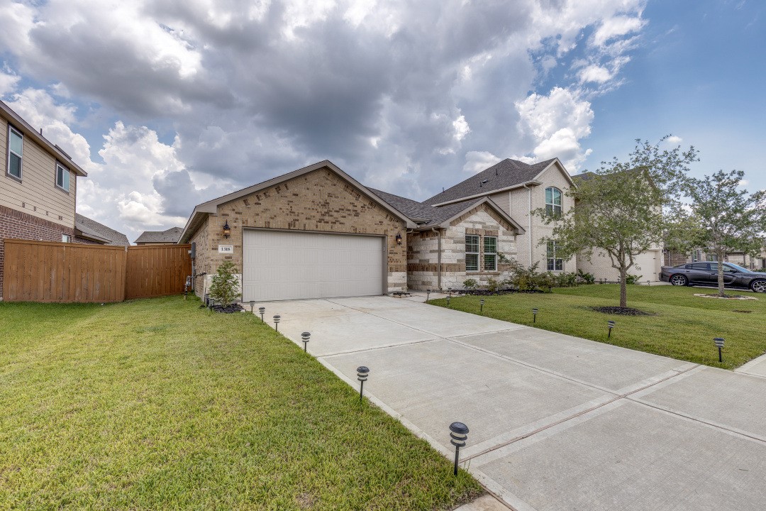 1318 Cascade Hls Drive Rosharon, TX 77583 - Photo 3 of 25 a view of outdoor space yard and garage