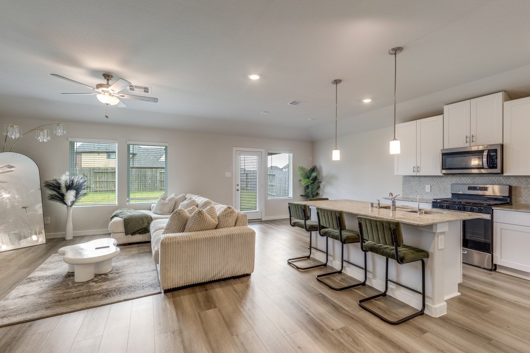 1318 Cascade Hls Drive Rosharon, TX 77583 - Photo 6 of 25 a living room with furniture kitchen view and a wooden floor