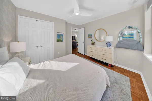 a bedroom with a bed and a dresser