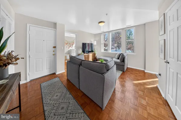 a living room with furniture and a rug