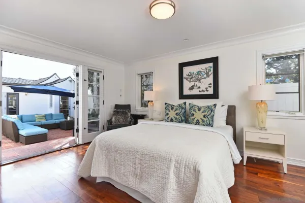 a bed room with a bed and a large window