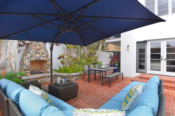 a living room with furniture and a umbrella