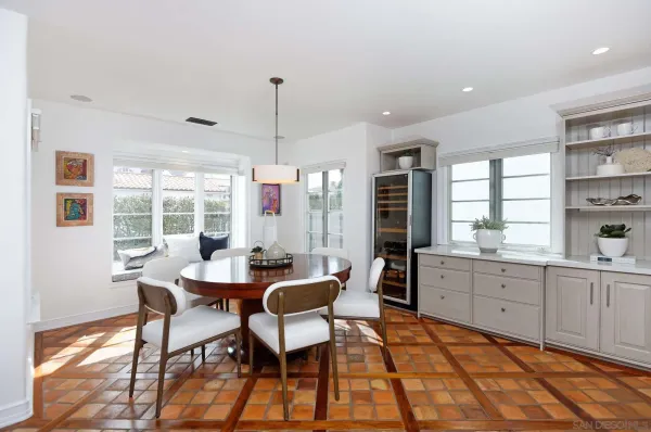 a view of a dining room with furniture window and outside view