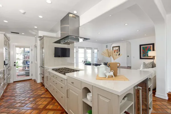 a kitchen with stainless steel appliances kitchen island granite countertop a sink and cabinets