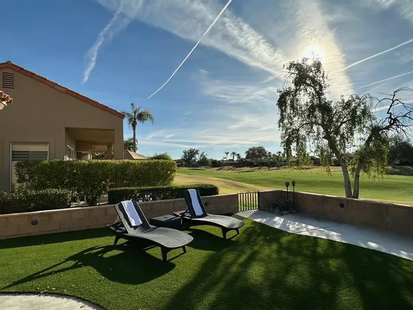 a garden view with a lake view