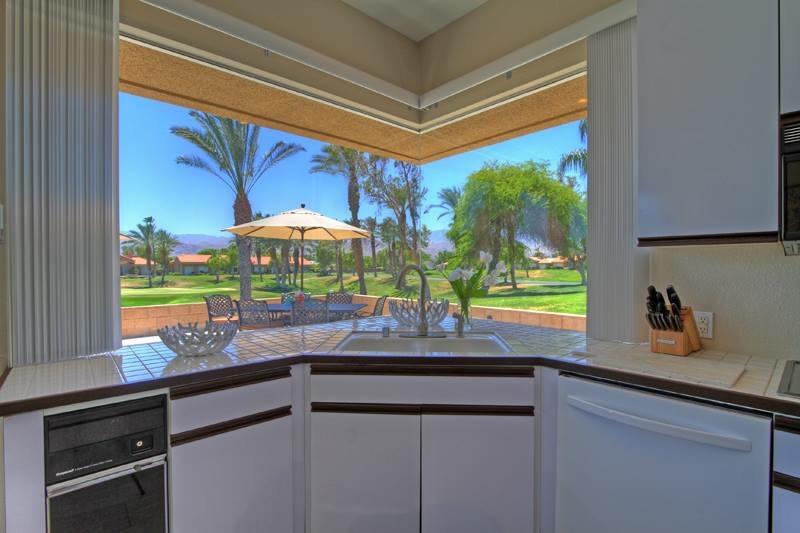 65 La Costa Drive Rancho Mirage, CA 92270 - Photo 13 of 22 a kitchen with a sink and a large window