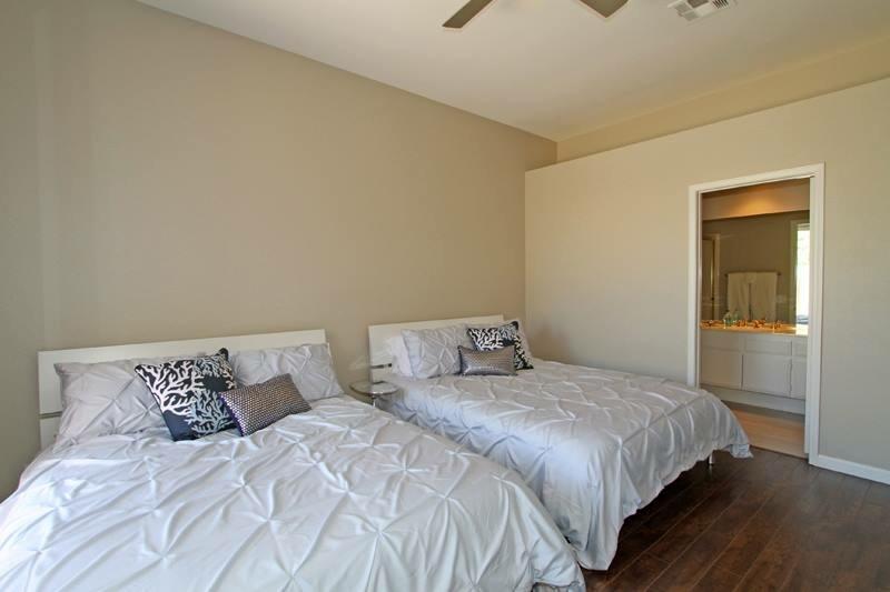 65 La Costa Drive Rancho Mirage, CA 92270 - Photo 17 of 22 a bedroom with a bed and a window