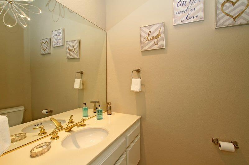 65 La Costa Drive Rancho Mirage, CA 92270 - Photo 19 of 22 a bathroom with a sink mirror and vanity