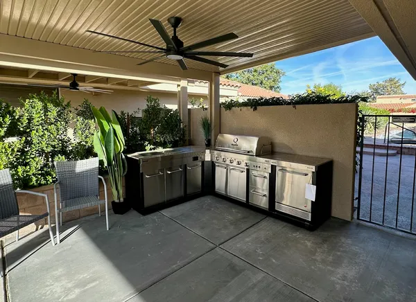 a utility room with stainless steel appliances granite countertop lots of counter top space