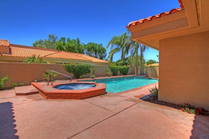 65 La Costa Drive Rancho Mirage, CA 92270 - Photo 7 of 22 a backyard of a house with outdoor seating
