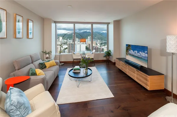 a living room with furniture and a large window