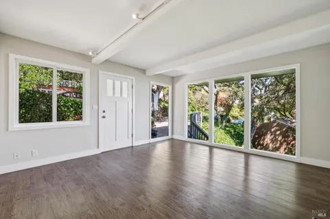 a view of a house with a backyard