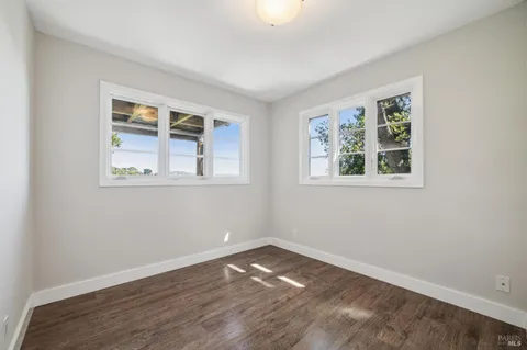 a view of a balcony with wooden floor