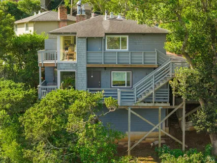 a aerial view of a house with a yard