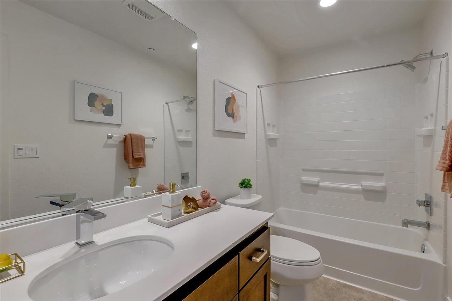 37524 Cape Cod Road, Unit 8 Newark, CA 94560 - Photo 19 of 24 a bathroom with a sink toilet tub and shower