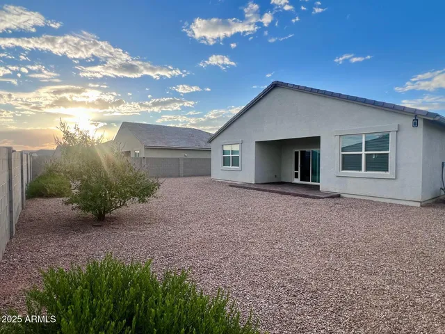 a view of a house with a yard and garage
