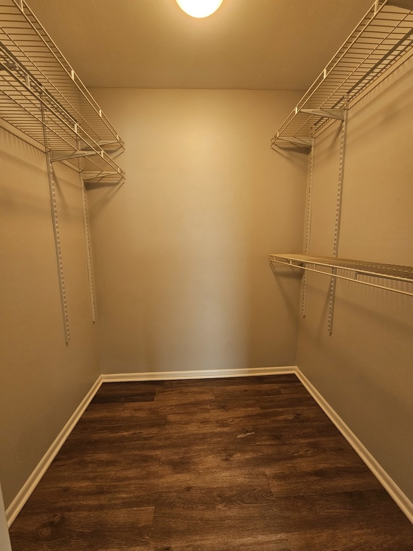 56 North Victoria Lane, Unit C Streamwood, IL 60107 - Photo 6 of 11 a view of a room with wooden floor
