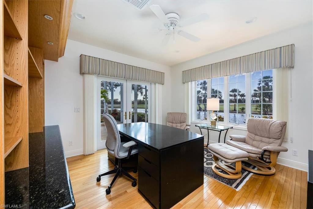 559 Eagle Creek Drive Naples, FL 34113 - Photo 20 of 26 a dining room with furniture and wooden floor
