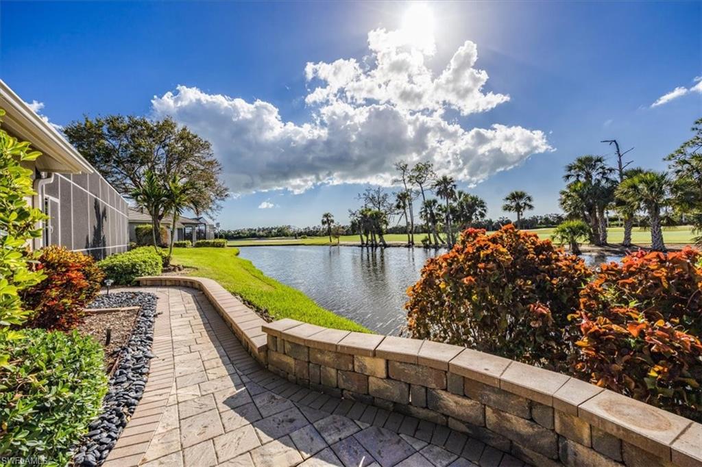 559 Eagle Creek Drive Naples, FL 34113 - Photo 26 of 26 a view of swimming pool with a garden