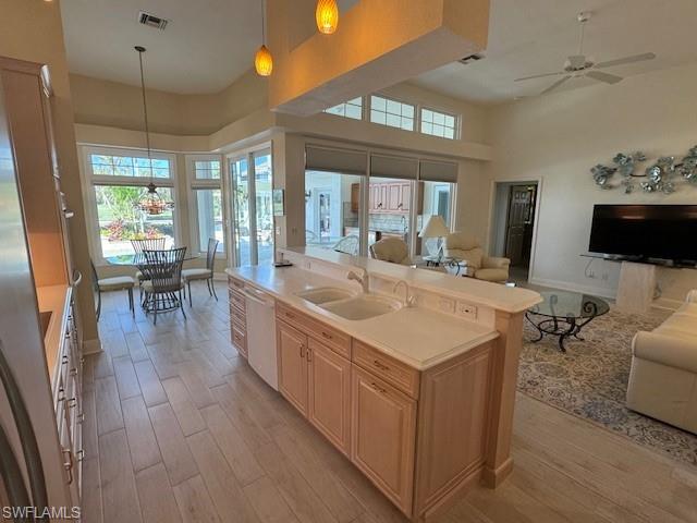 559 Eagle Creek Drive Naples, FL 34113 - Photo 8 of 26 a large white kitchen with a large window