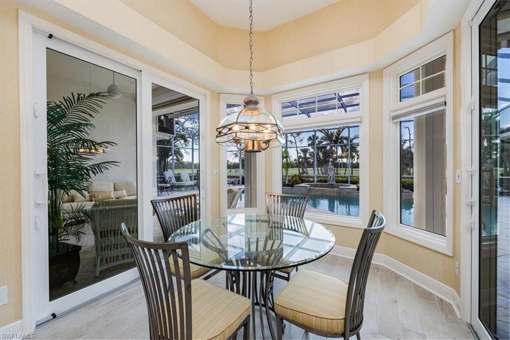 559 Eagle Creek Drive Naples, FL 34113 - Photo 9 of 26 a view of a dining room with furniture window and outside view