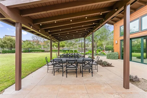 a view of a porch with chairs and backyard