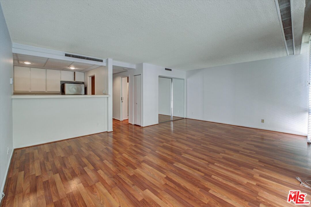 2160 Century Park East, Unit 103 Los Angeles, CA 90067 - Photo 5 of 37 a view of empty room with wooden floor
