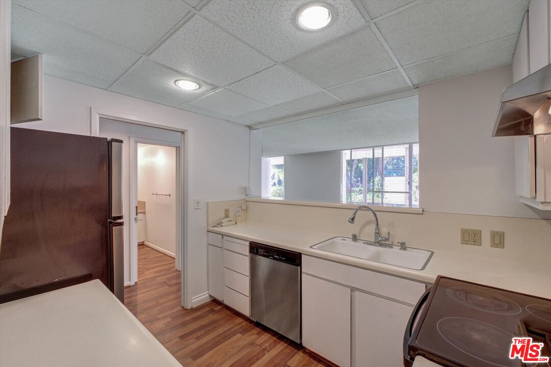 2160 Century Park East, Unit 103 Los Angeles, CA 90067 - Photo 7 of 37 a bathroom with a sink and a mirror