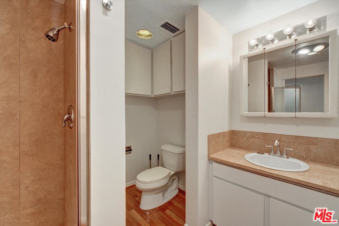 2160 Century Park East, Unit 103 Los Angeles, CA 90067 - Photo 10 of 37 a bathroom with a sink toilet and shower
