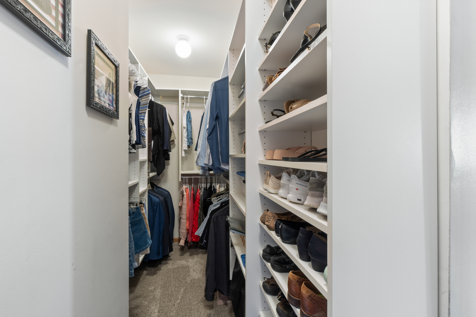 1985 Rochelle Court Wheeling, IL 60090 - Photo 14 of 38 a view of walk in closet with clothes and shoes