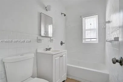 a bathroom with a sink a mirror and a shower