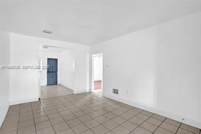 a view of an empty room and window