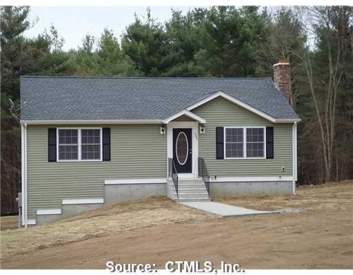 77-lot1 Shepard Hill Road Danielson, CT 06239 - Photo 1 of 1 a front view of a house with a yard and garage