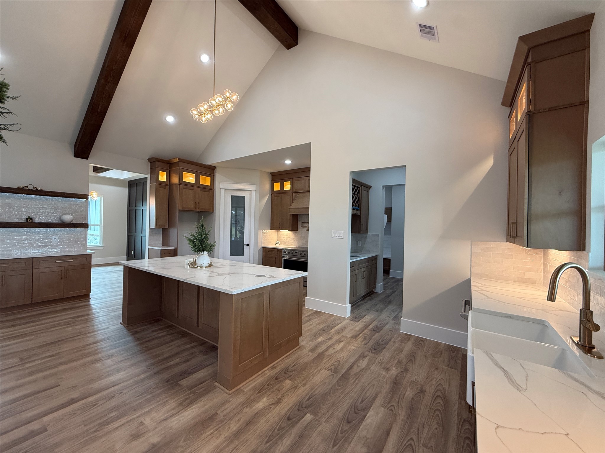 1214 Quarter Horse Trail Angleton, TX 77515 - Photo 12 of 32 a large kitchen with stainless steel appliances kitchen island granite countertop a large counter top and sink